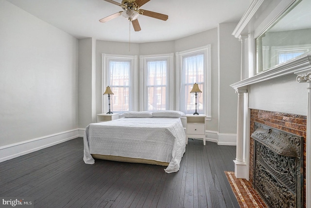 bedroom with dark wood-type flooring and ceiling fan