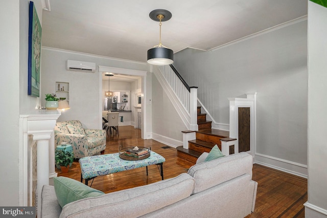 living room featuring crown molding, dark hardwood / wood-style floors, and a wall unit AC