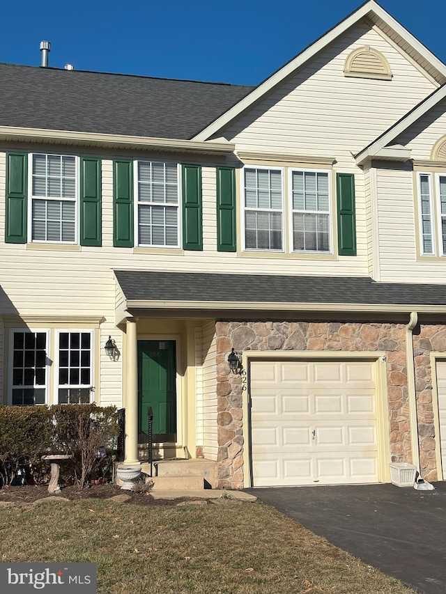 townhome / multi-family property featuring a garage