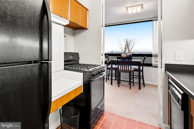 kitchen with light tile patterned floors and black appliances