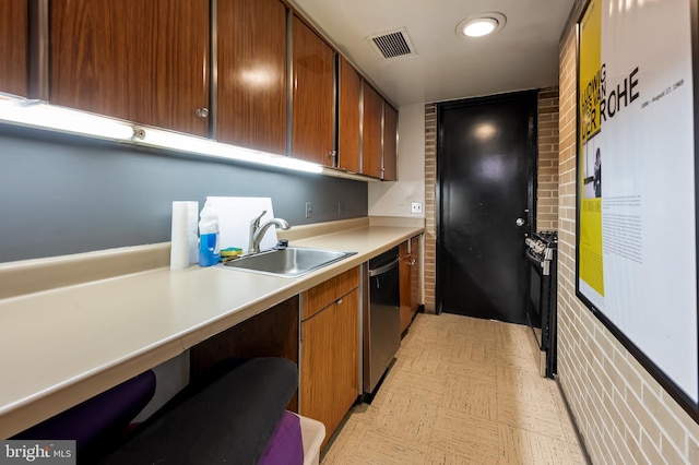 kitchen featuring black range with gas stovetop, dishwasher, and sink