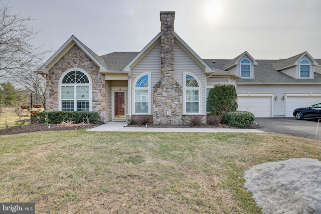 view of front of home with a garage and a front yard