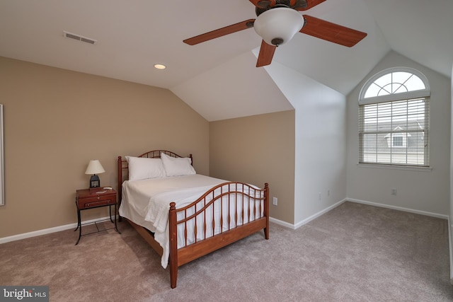 carpeted bedroom with ceiling fan and lofted ceiling