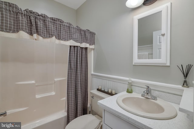 full bathroom with vanity, toilet, and shower / bath combo