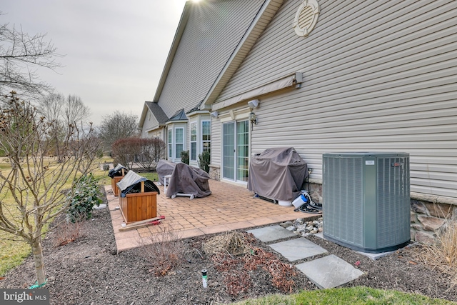 view of patio featuring a grill and cooling unit