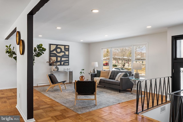 living room featuring a baseboard radiator and light parquet floors