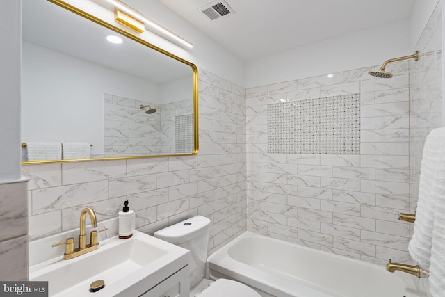 full bathroom with tasteful backsplash, tile walls, tiled shower / bath combo, vanity, and toilet