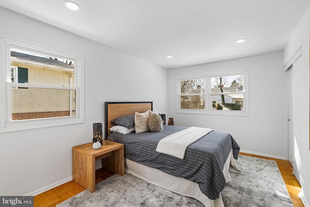 bedroom featuring light parquet flooring