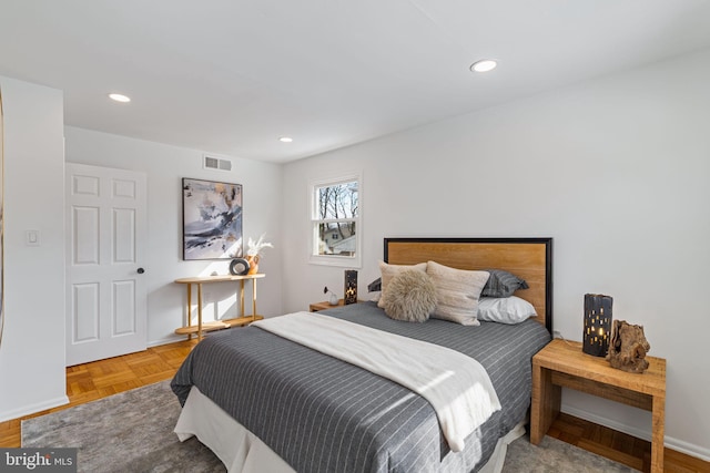 bedroom with parquet flooring