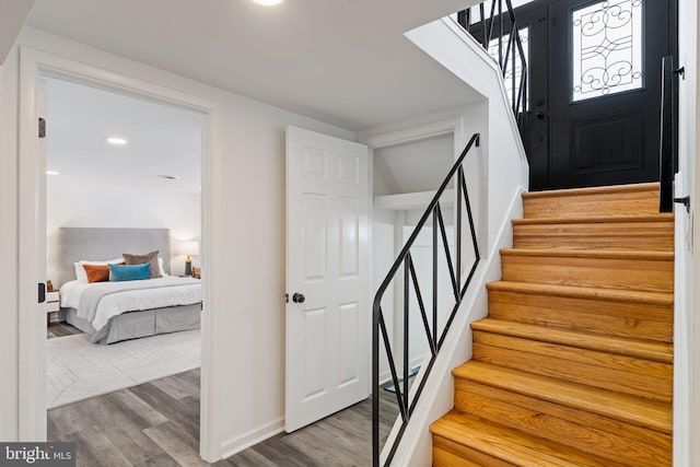 stairway featuring hardwood / wood-style floors