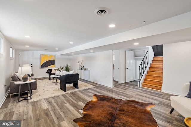 recreation room with light hardwood / wood-style flooring