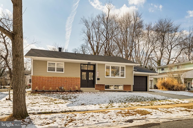 split foyer home with french doors and a garage