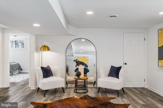 sitting room featuring hardwood / wood-style floors