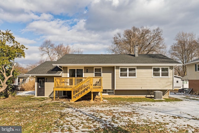 back of house with a wooden deck and central AC unit