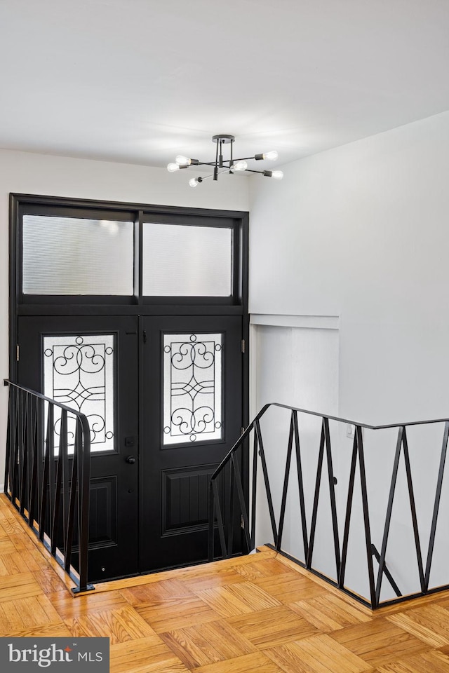 entrance foyer featuring parquet flooring