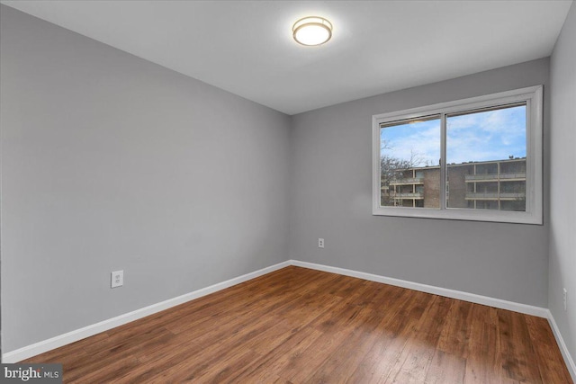 empty room with wood-type flooring