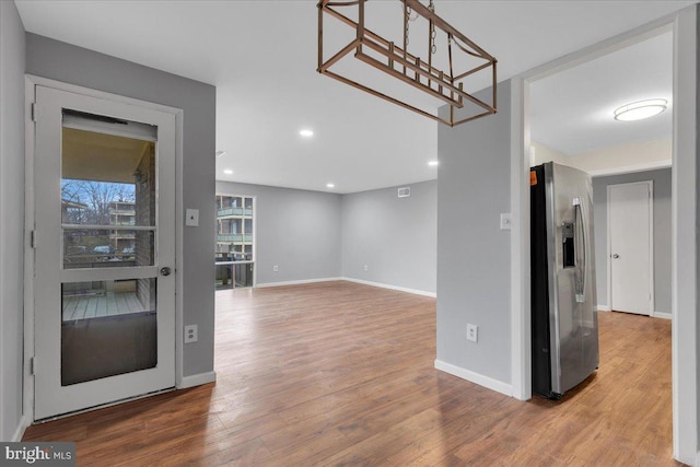 interior space with hardwood / wood-style flooring