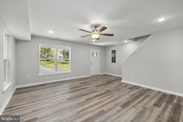 interior space featuring wood-type flooring and ceiling fan