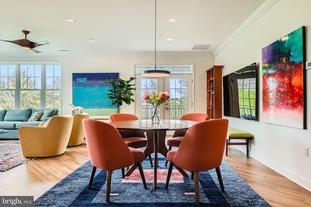 dining area with recessed lighting, wood finished floors, visible vents, a ceiling fan, and crown molding
