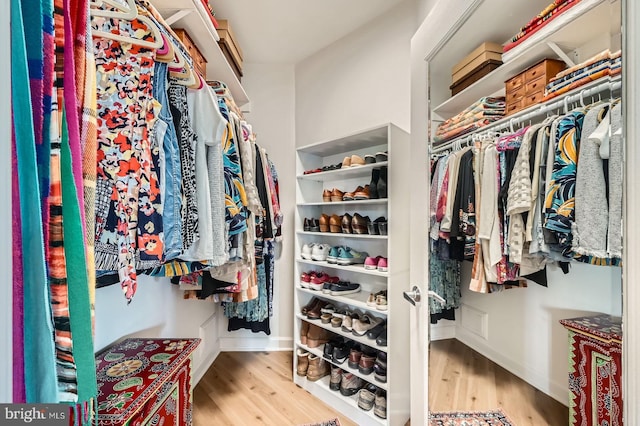 spacious closet with wood finished floors