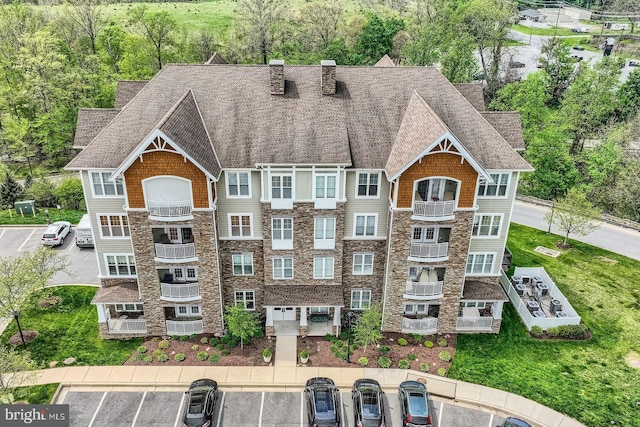 view of building exterior with uncovered parking