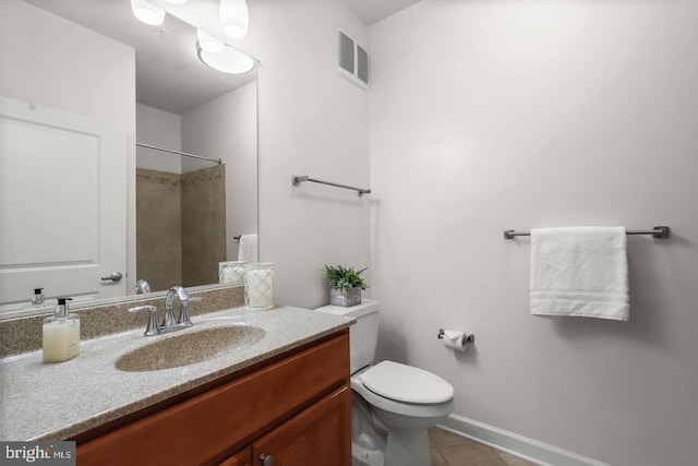 bathroom featuring visible vents, baseboards, toilet, tile patterned floors, and vanity