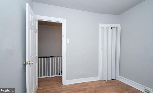 spare room featuring light wood-type flooring