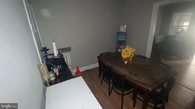 dining room with dark hardwood / wood-style floors