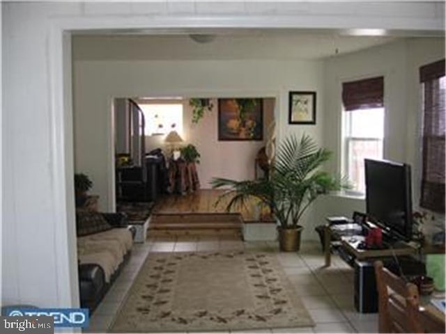 living area featuring tile patterned flooring