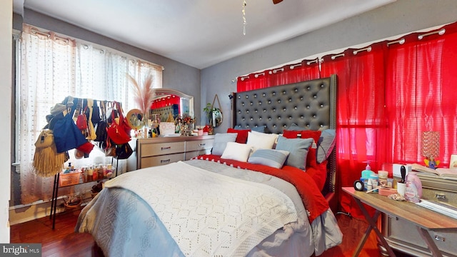 bedroom with ceiling fan and wood finished floors