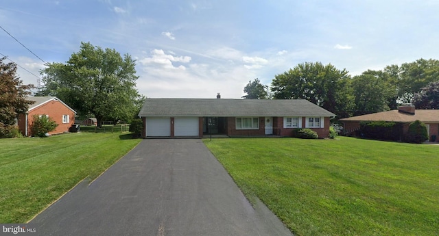 single story home with a garage and a front lawn