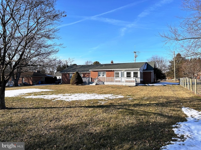 exterior space featuring covered porch and a lawn