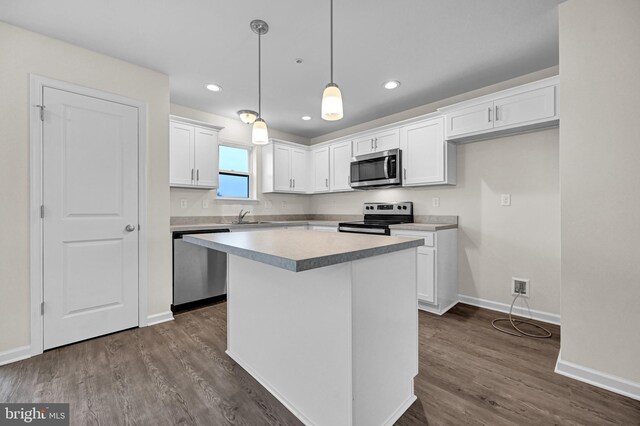 4 Landing Pl Unit 4, York, PA 17408 - kitchen featuring white cabinetry, decorative light fixtures, stainless steel appliances, and a center island