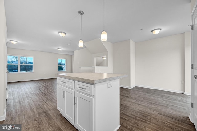 4 Landing Pl Unit 4, York, PA 17408 - kitchen with pendant lighting, dark wood-type flooring, white cabinets, and a kitchen island