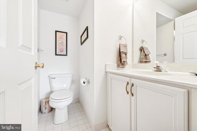 bathroom featuring vanity, tile patterned floors, and toilet