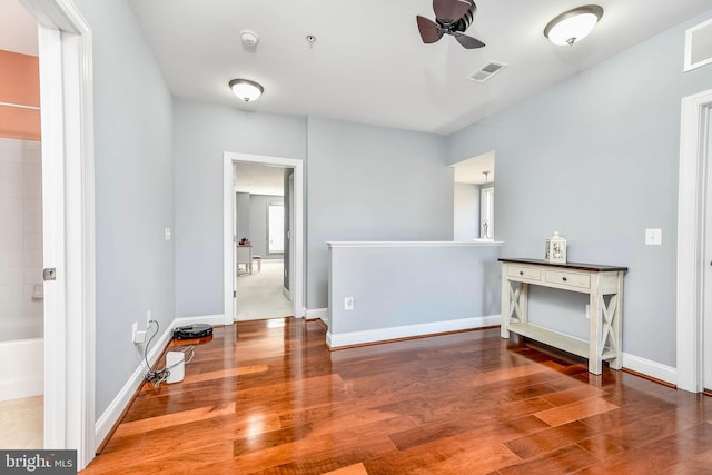 interior space featuring hardwood / wood-style floors and ceiling fan