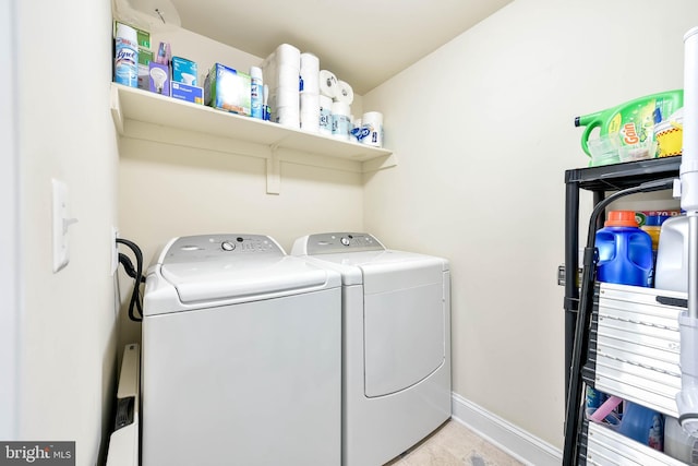 washroom featuring washing machine and clothes dryer