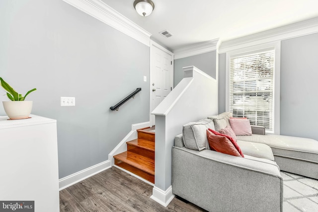 living room with hardwood / wood-style flooring and crown molding