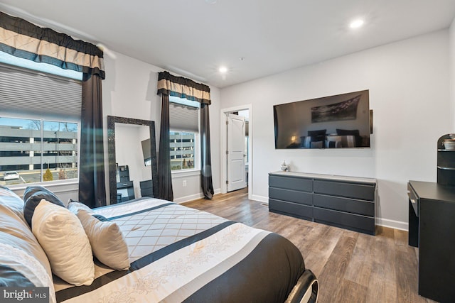 bedroom with hardwood / wood-style flooring