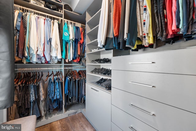 walk in closet featuring hardwood / wood-style floors