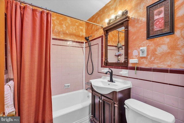 full bathroom with shower / bath combination with curtain, vanity, toilet, and tile walls