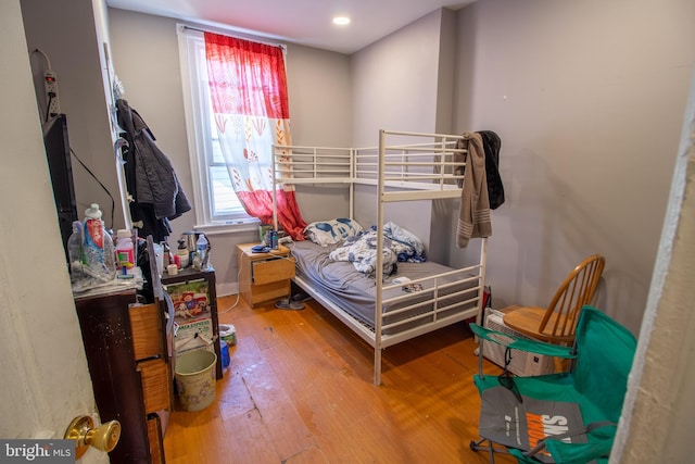 bedroom featuring wood-type flooring