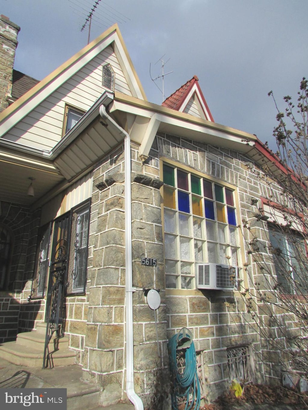 view of side of home featuring cooling unit