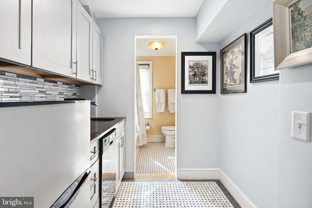 clothes washing area featuring sink