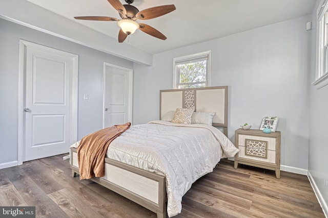 bedroom with wood-type flooring and ceiling fan