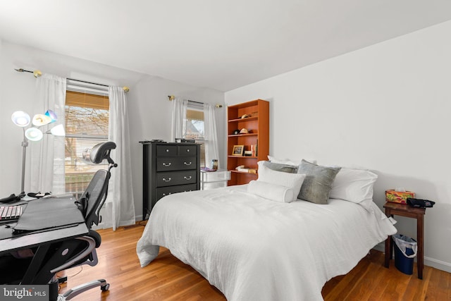 bedroom featuring wood-type flooring