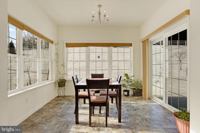 sunroom with a chandelier