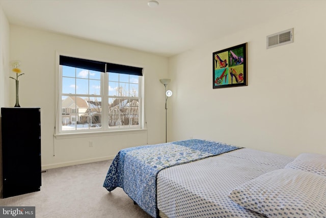 bedroom featuring light colored carpet