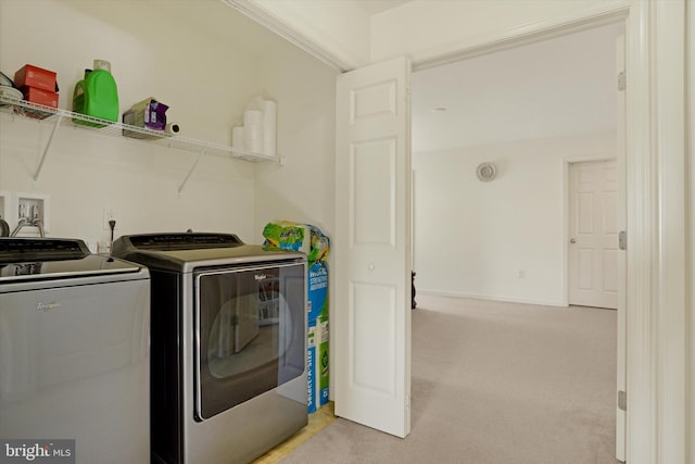 clothes washing area featuring light carpet and washing machine and dryer