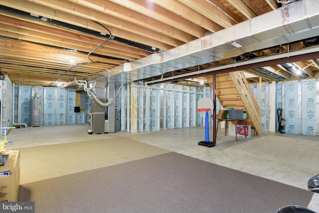 basement featuring heating unit and water heater